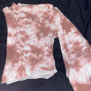 A pink tie dye crop top long sleeve